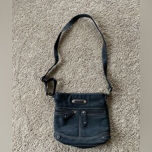 Black cross body purse. Adjustable strap, inner/outer pockets